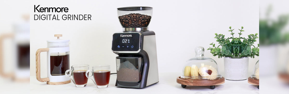 Kenmore digital burr coffee grinder with a white French Press coffeemaker and two cups of coffee