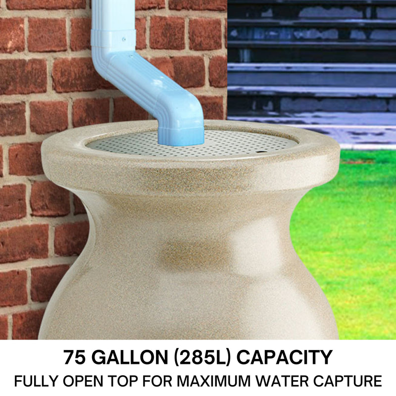 Closeup of the top half of a Koolscapes decorative sandstone-look rainwater urn set up below a white downspout with a red brick wall in the background. Text below reads, "75 gallon (285L) capacity: Fully open top for maximum water capture."